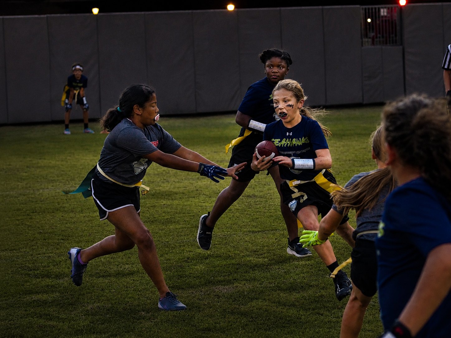Girls flag football under the lights